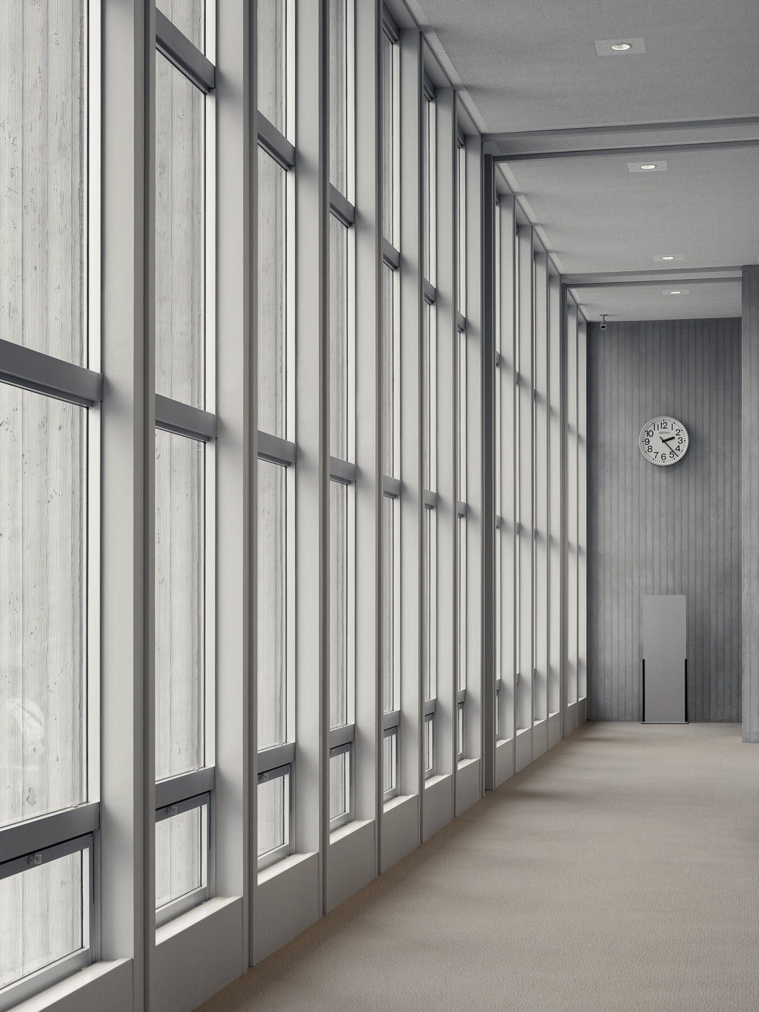 hiroshima-peace-memorial-museum-kenzo-tange-interior-corridor-glass-panels-clock-thibaud-poirier