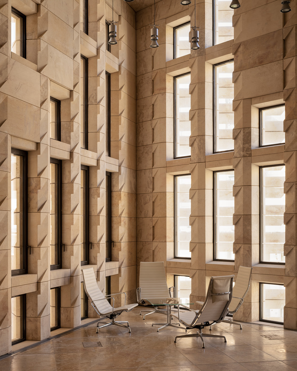 malta-parliament-house-renzo-piano-lobby-limestone-walls-tall-windows-eames-chairs-thibaud-poirier