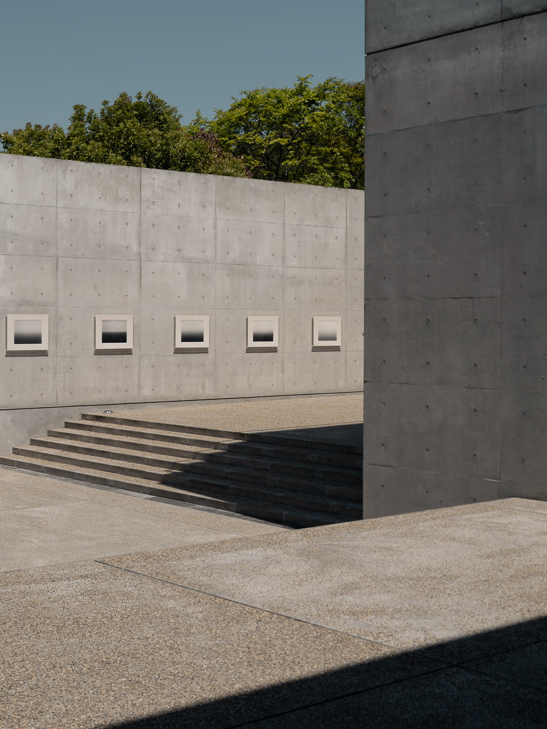 naoshima-tadao-ando-concrete-facade-square-windows-steps-thibaud-poirier-Benesse-House-Sugimoto